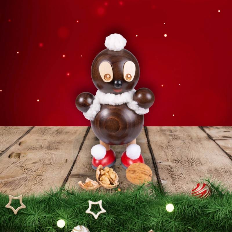 Schnatterinchen Räucherfigur mit weihnachtlichem Hintergrund